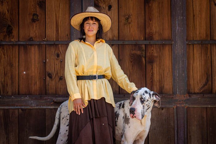 Large dog standing behind owner